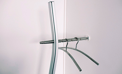 Curved wall-mounted coat rack