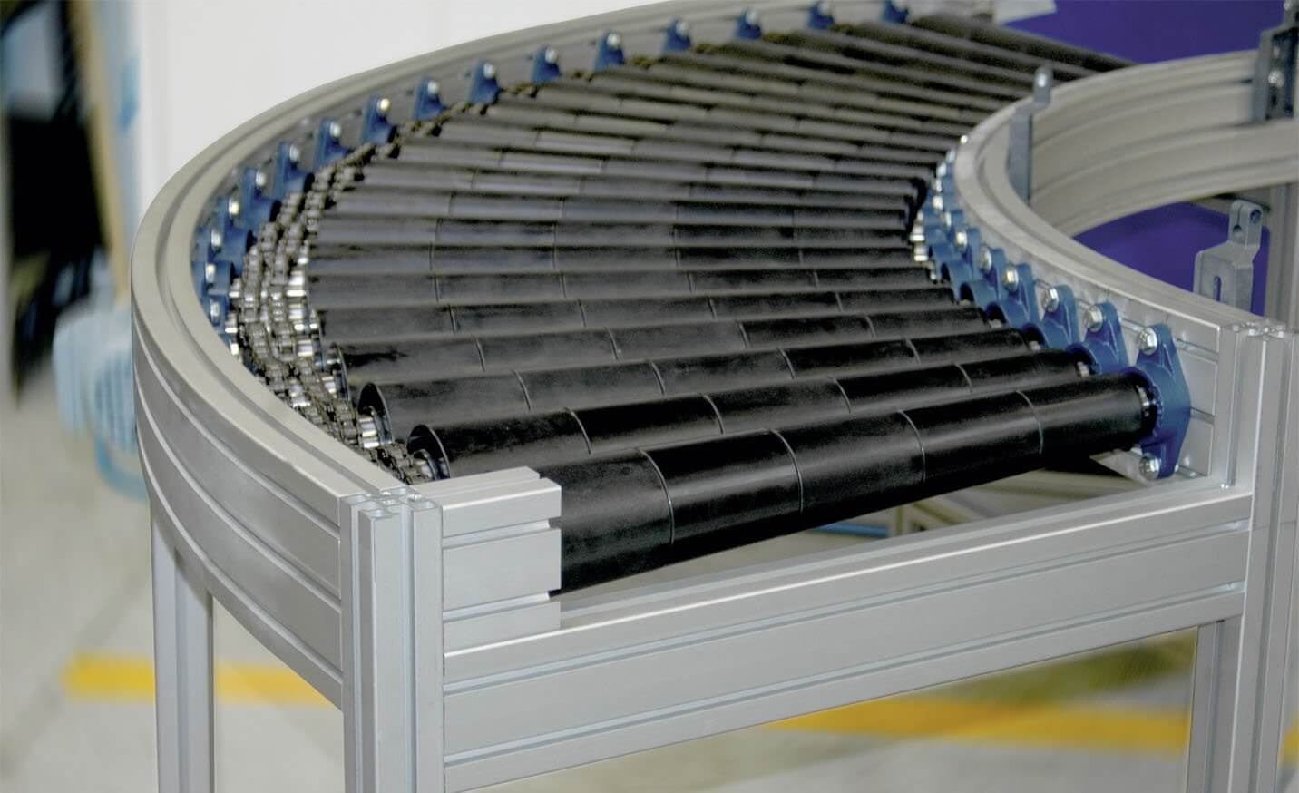 Roller conveyor system - driven curved roller conveyor